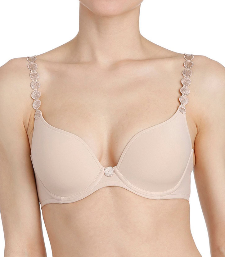 Woman modelling padded plunge t-shirt bra in beige colour.